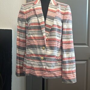 Women’s blazer with gold bottoms